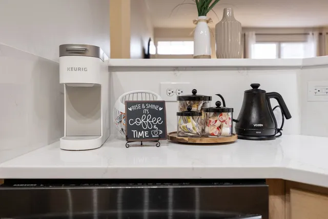 a table with a vase and flowers on it