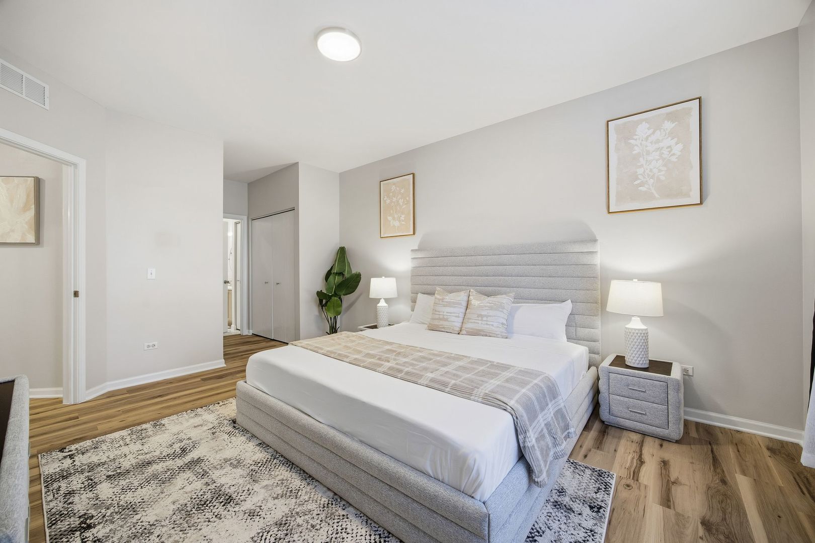 8232 Concord Lane, Unit B Justice, IL 60458 - Photo 18 of 32 a bedroom with a bed and a dresser