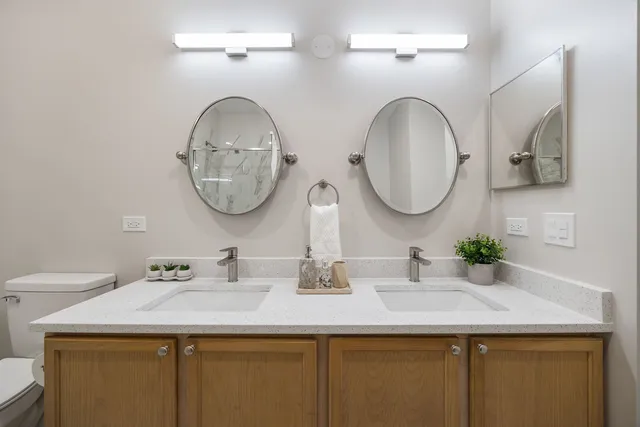 a bedroom with a bed and a painting