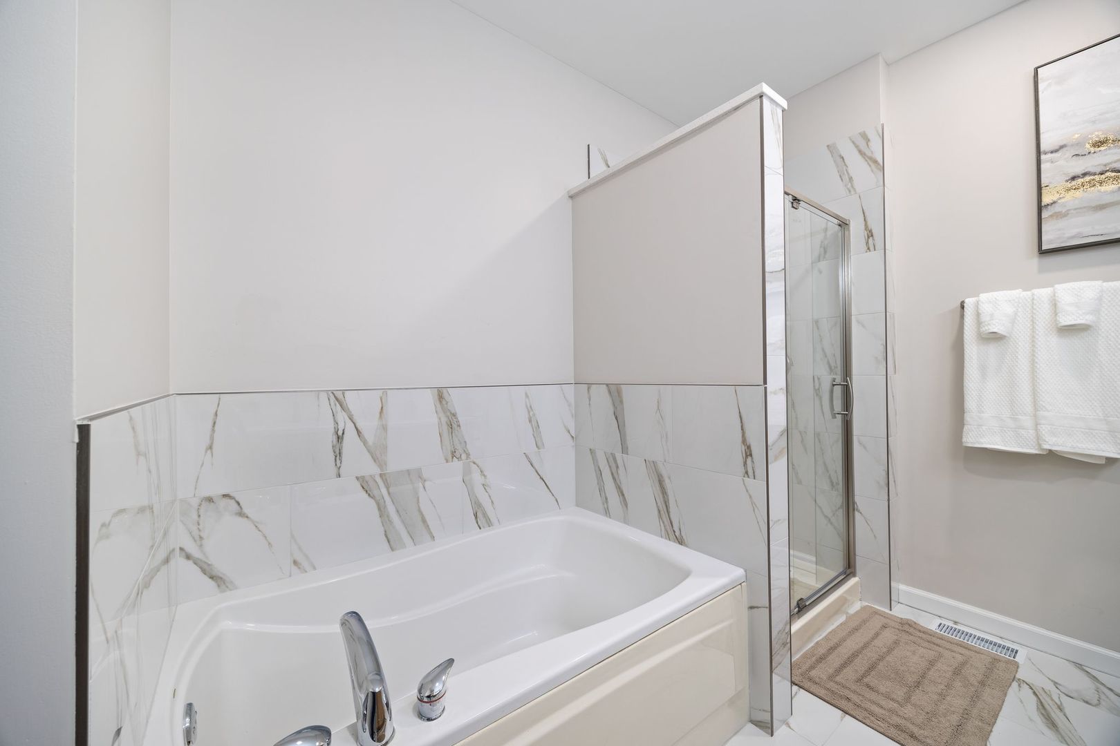 8232 Concord Lane, Unit B Justice, IL 60458 - Photo 25 of 32 a bathroom with a tub and shower