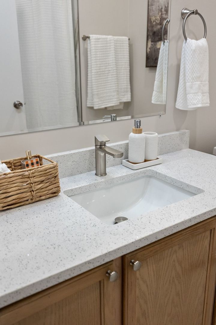 8232 Concord Lane, Unit B Justice, IL 60458 - Photo 31 of 32 a bathroom with a sink and a mirror