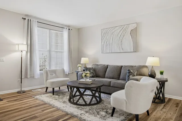 a living room with furniture and a window