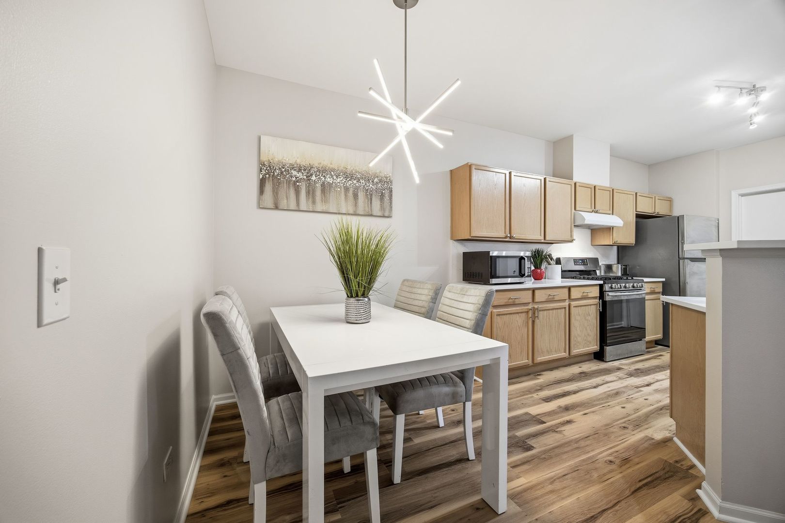 8232 Concord Lane, Unit B Justice, IL 60458 - Photo 8 of 32 a kitchen with a table chairs refrigerator and cabinets