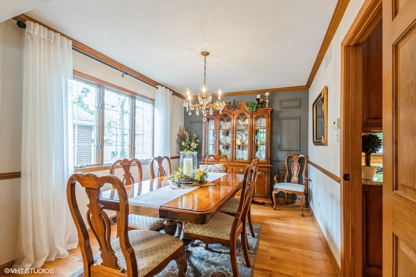18038 Whitman Lane Lansing, IL 60438 - Photo 6 of 20 a view of a dining room with furniture window and wooden floor