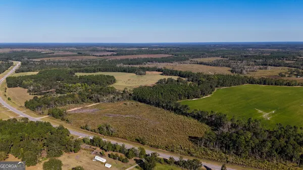 an aerial view of a houses with outdoor space
