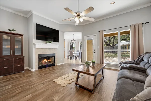 a living room with furniture fireplace and flat screen tv