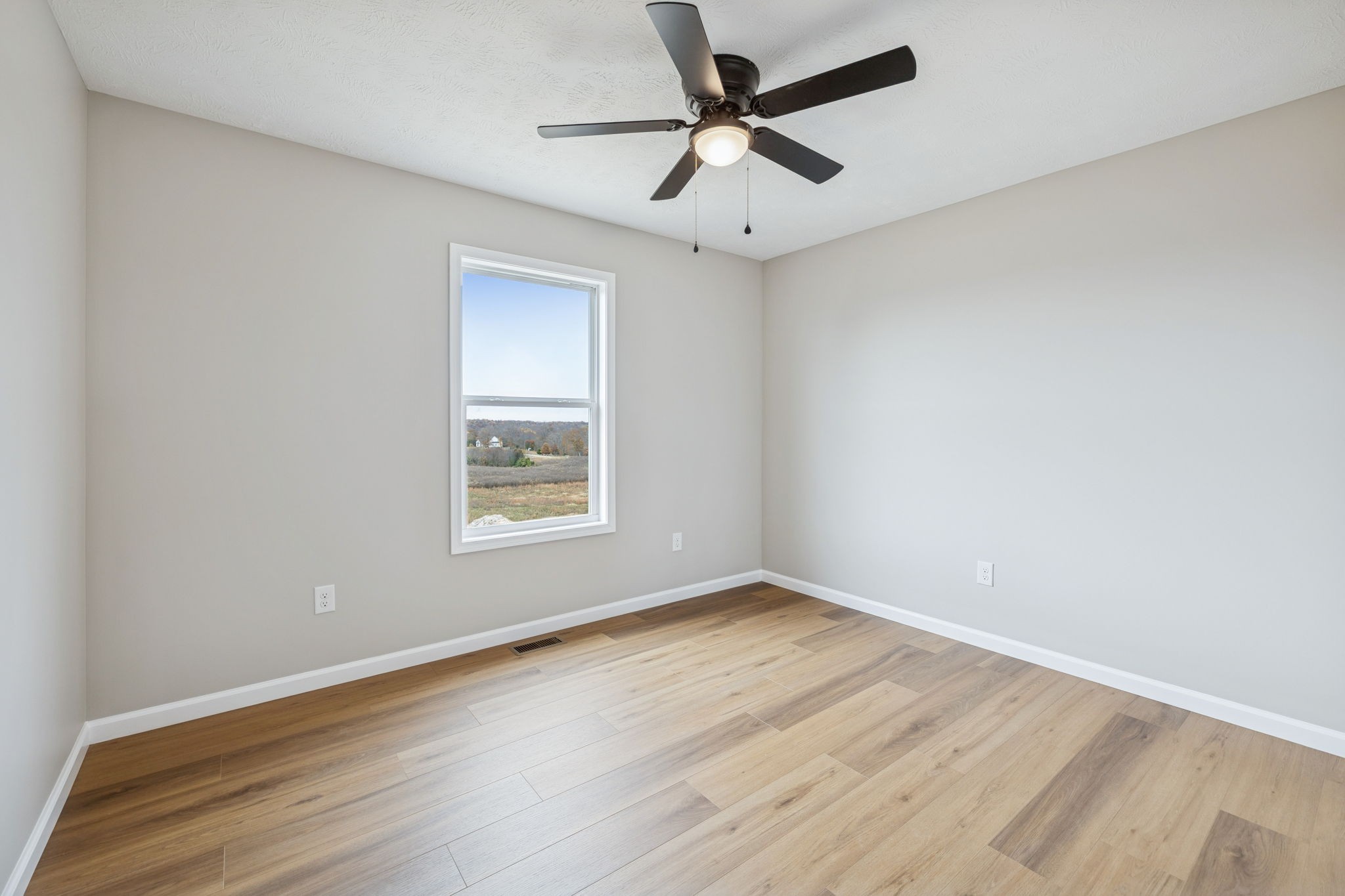 2649 Oak Knob Road Lafayette, TN 37083 - Photo 21 of 34 an empty room with a window and a fan