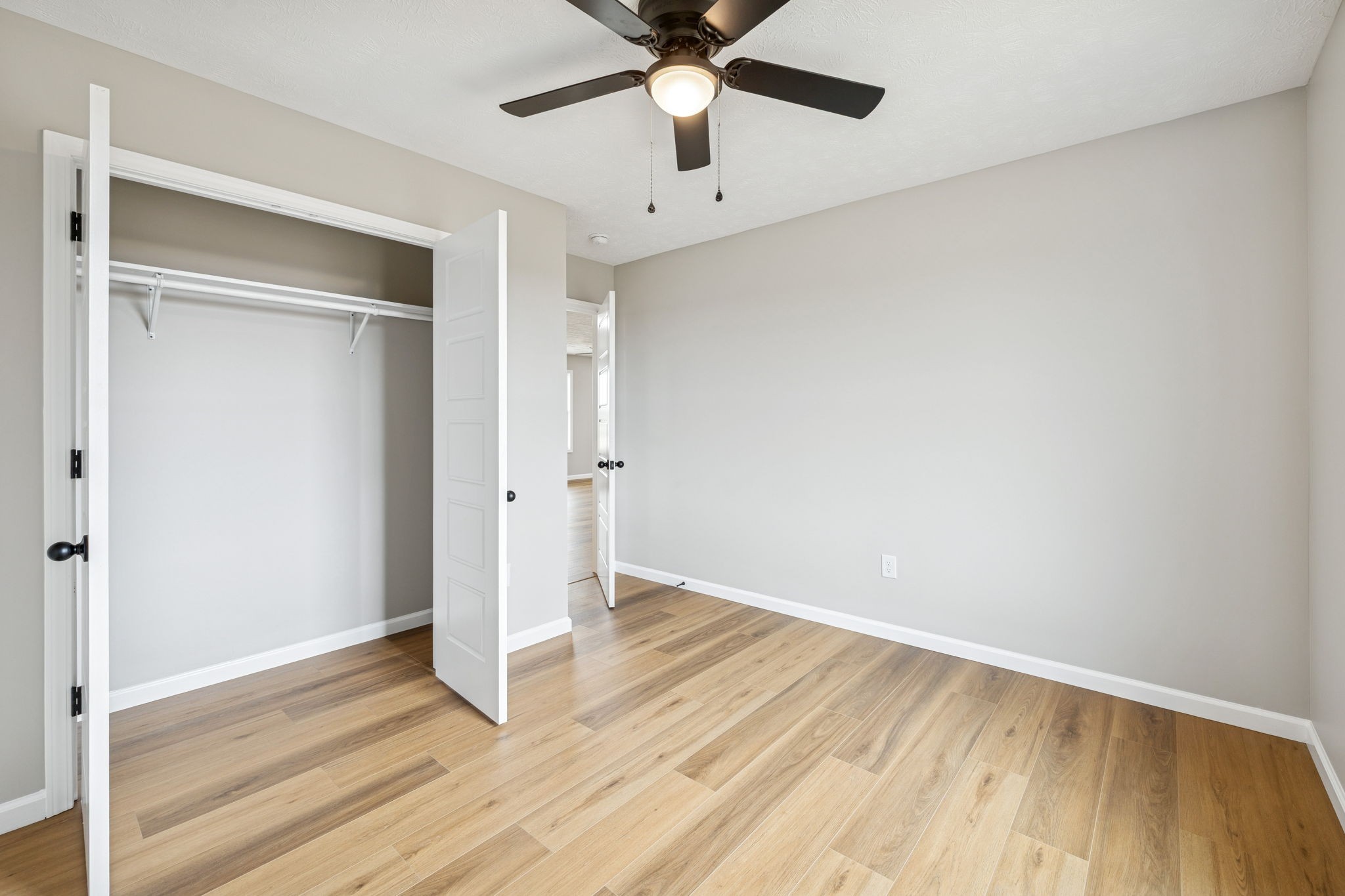2649 Oak Knob Road Lafayette, TN 37083 - Photo 23 of 34 a view of an empty room with window and a ceiling fan