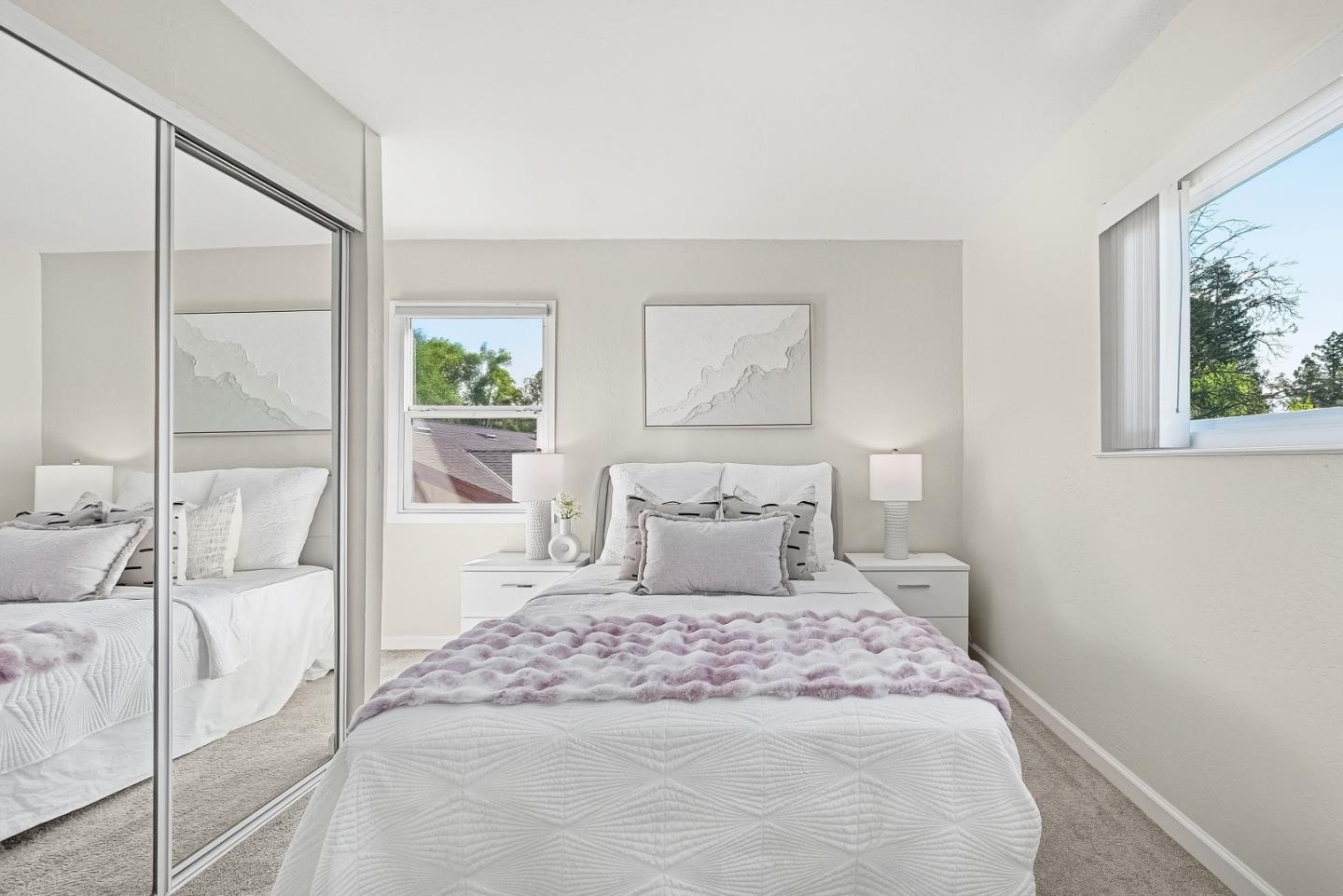 701 North Rengstorff Avenue, Unit 7 Mountain View, CA 94043 - Photo 23 of 32 a bedroom with a large bed and a large window
