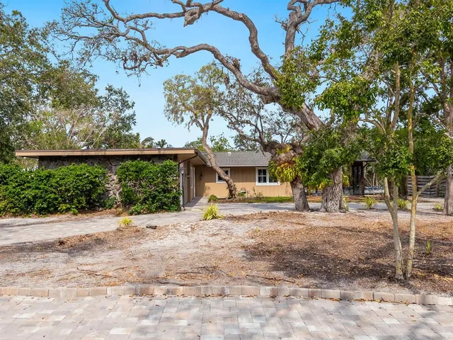 a house with trees in the background