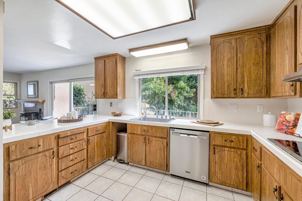 431 Green Hills Drive Millbrae, CA 94030 - Photo 13 of 50 a kitchen with sink cabinets and window