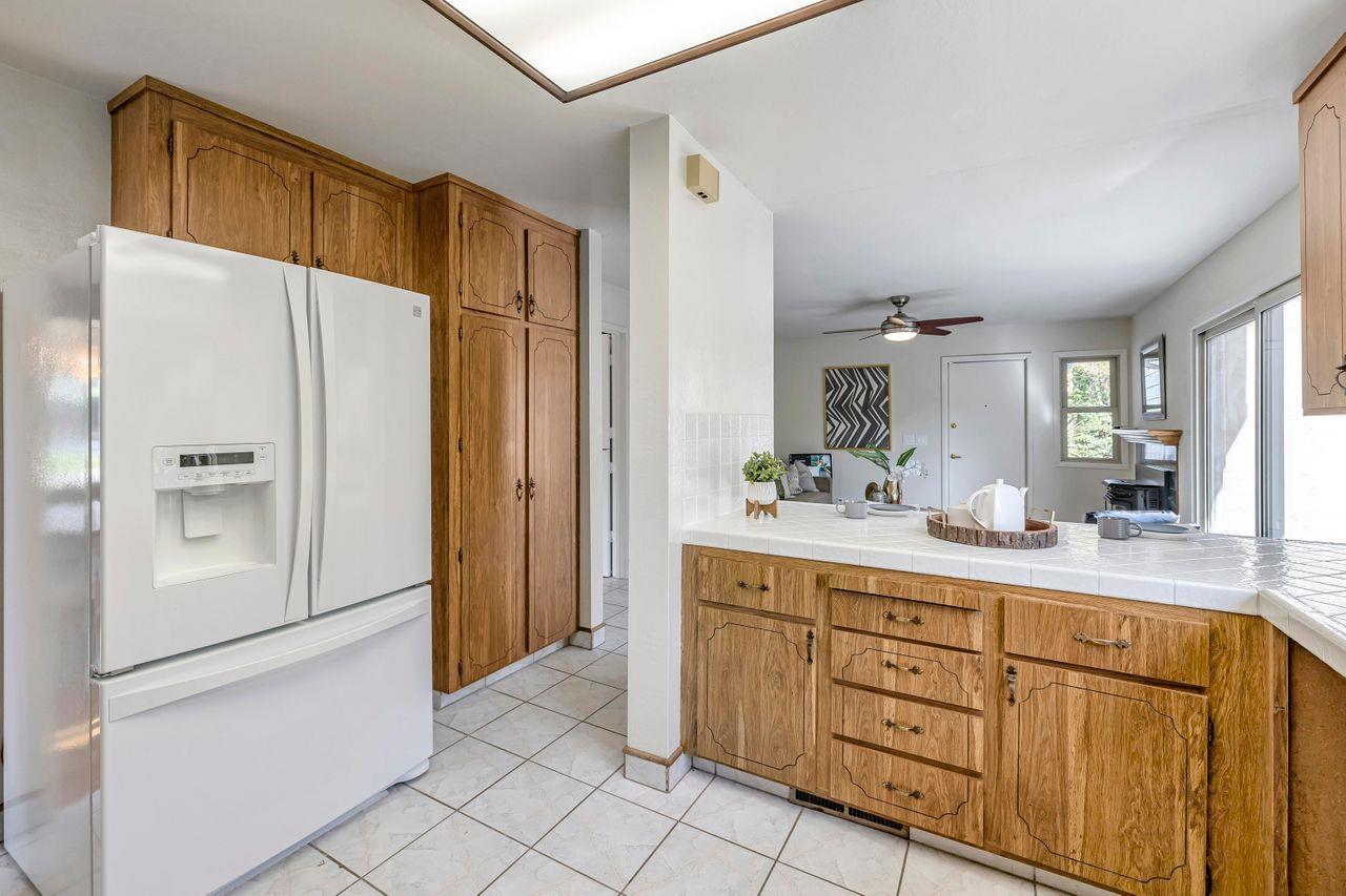 431 Green Hills Drive Millbrae, CA 94030 - Photo 15 of 50 a kitchen with white cabinets and refrigerator