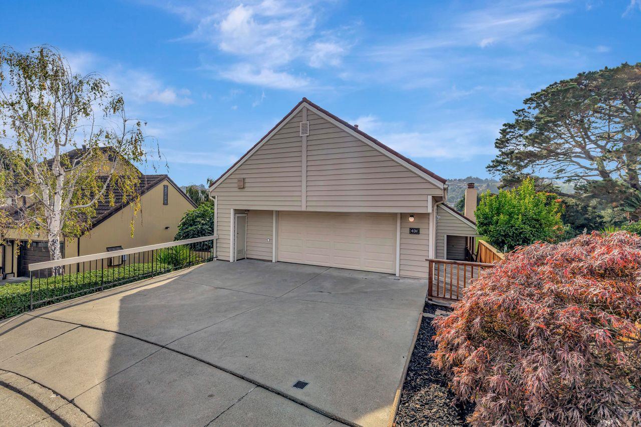 431 Green Hills Drive Millbrae, CA 94030 - Photo 2 of 50 a front view of a house with a yard and garage