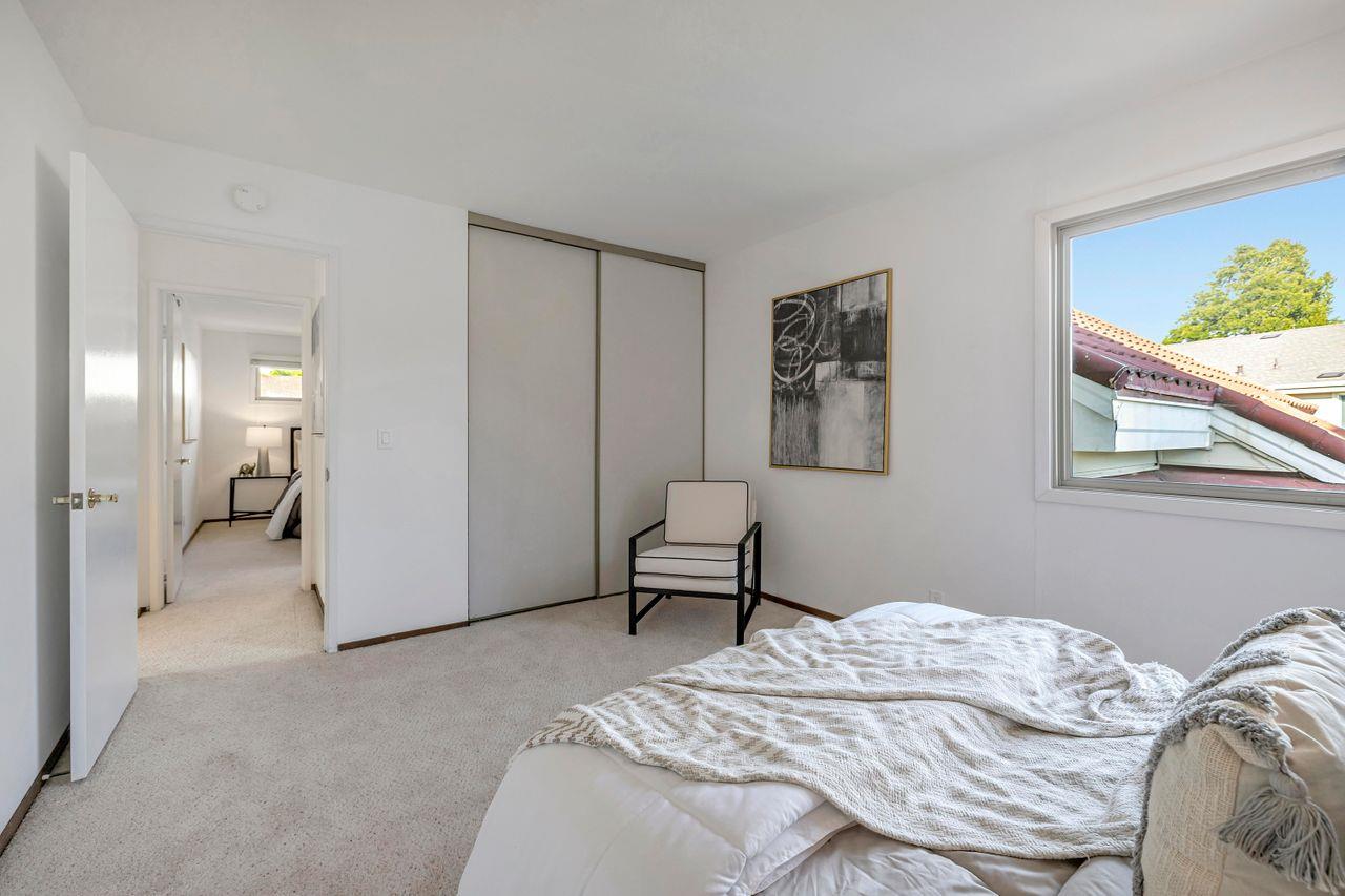 431 Green Hills Drive Millbrae, CA 94030 - Photo 26 of 50 a bedroom with a bed and a painting on the wall