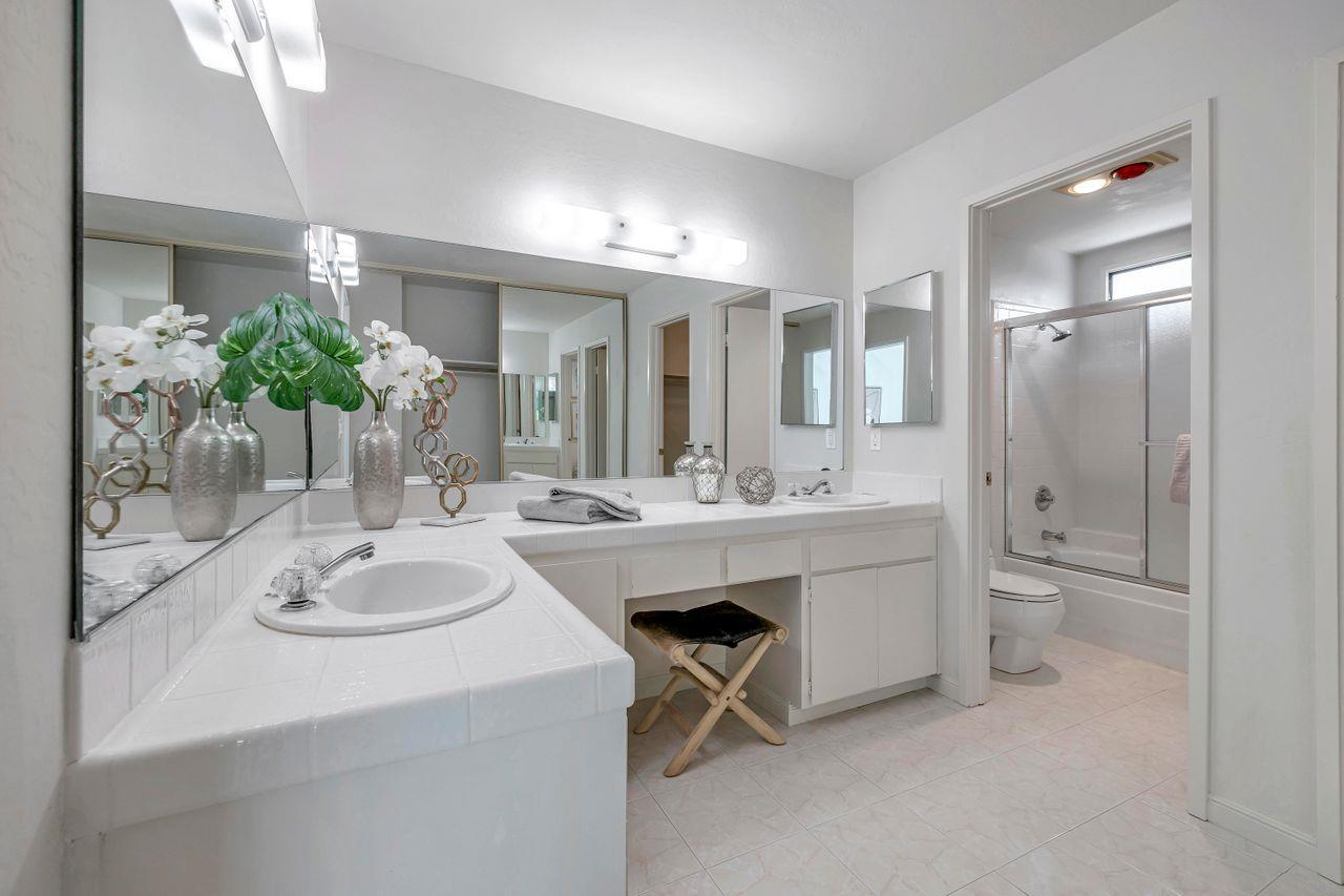 431 Green Hills Drive Millbrae, CA 94030 - Photo 30 of 50 a bathroom with a sink double vanity and a mirror