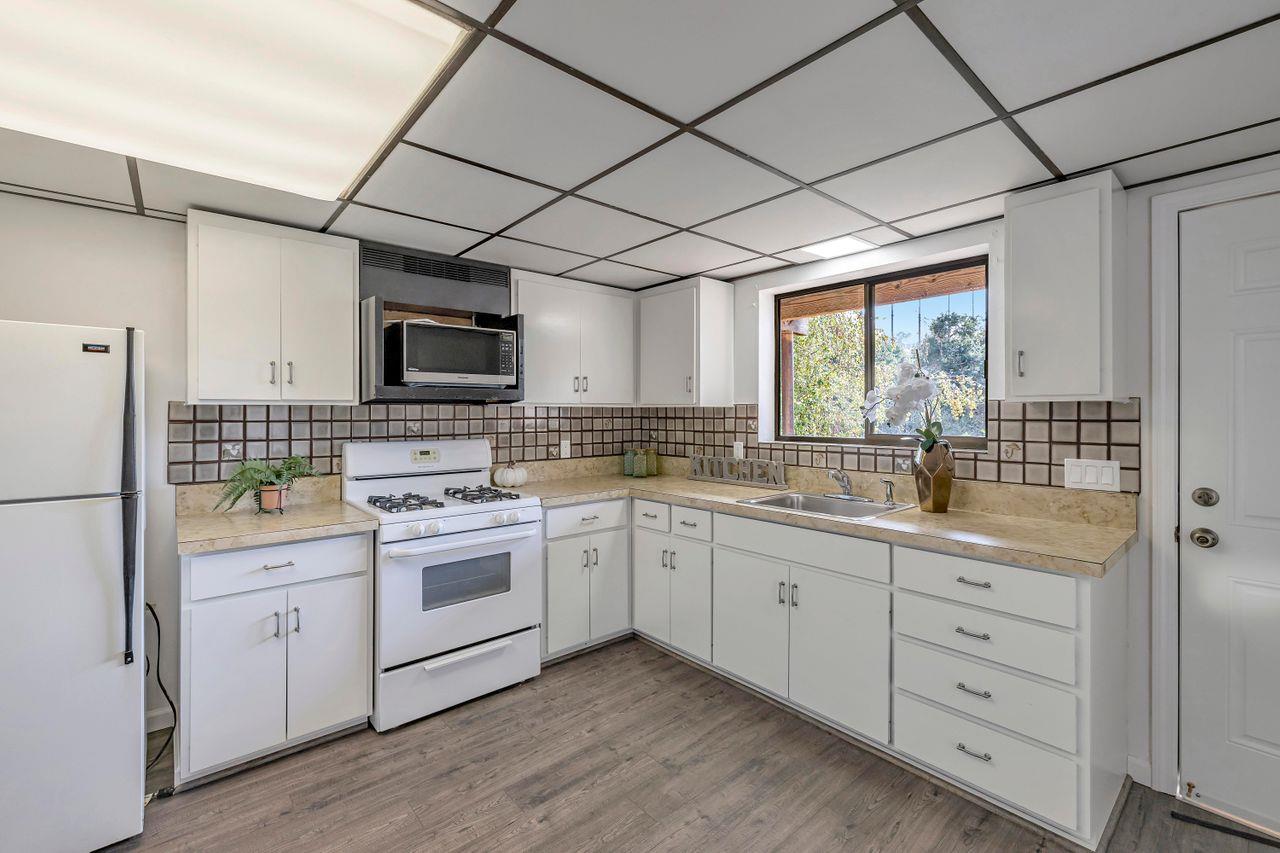 431 Green Hills Drive Millbrae, CA 94030 - Photo 36 of 50 a kitchen with a sink stove and refrigerator