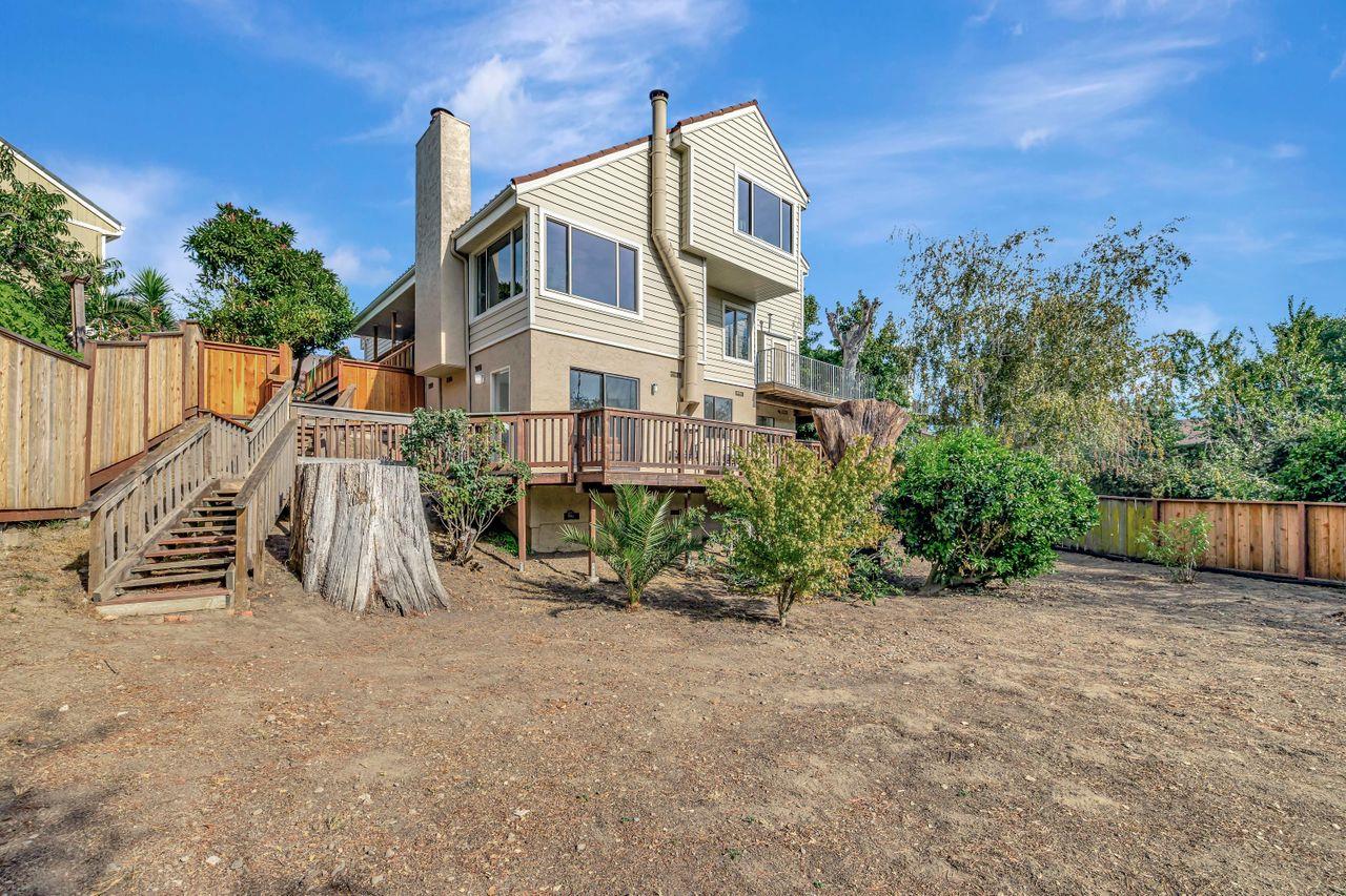 431 Green Hills Drive Millbrae, CA 94030 - Photo 47 of 50 a view of a house with a yard and fence
