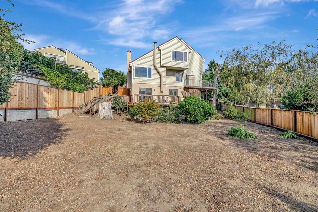 431 Green Hills Drive Millbrae, CA 94030 - Photo 48 of 50 a front view of a house with a yard and garage