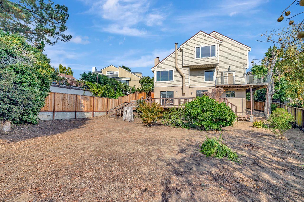431 Green Hills Drive Millbrae, CA 94030 - Photo 49 of 50 a front view of a house with a yard and garage