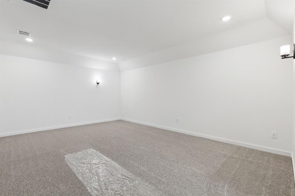 1608 Angus Trail Van Alstyne, TX 75495 - Photo 13 of 24 an empty room with a workbench