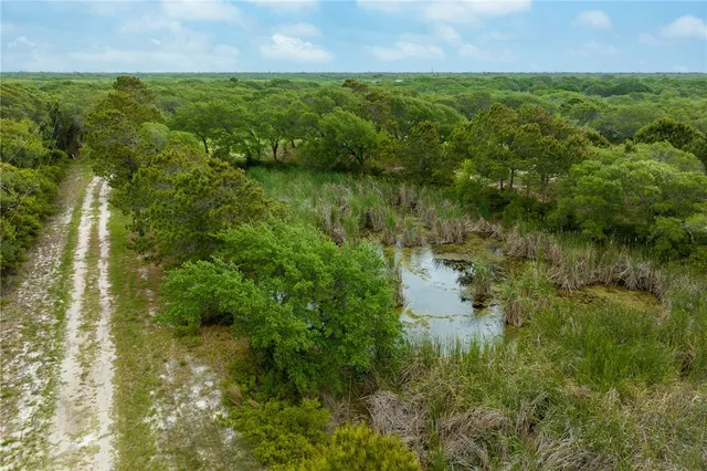 a view of a lake view with houses in back