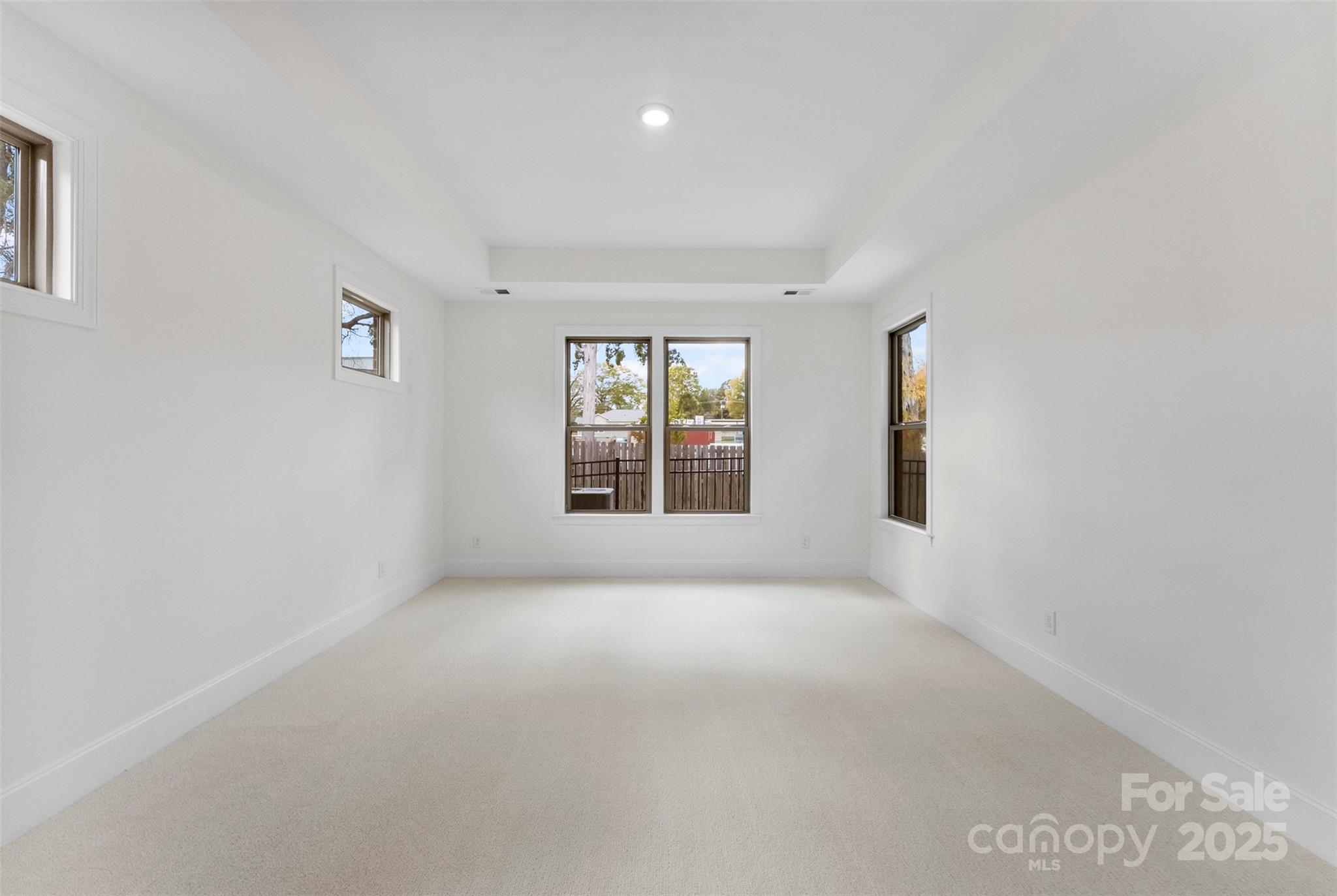 415 Newstyle Way Gastonia, NC 28056 - Photo 11 of 26 a view of a big room with windows and chandelier fan