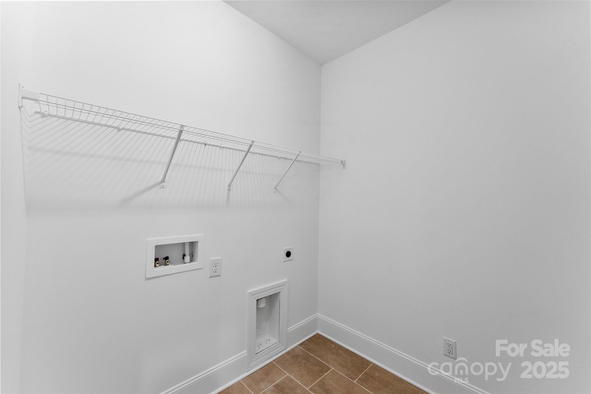415 Newstyle Way Gastonia, NC 28056 - Photo 16 of 26 a view of a room with racks on the wall