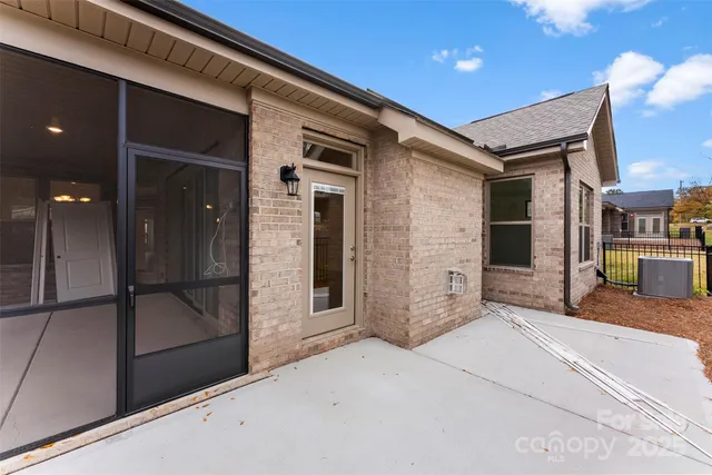 a view of a hallway with a chair