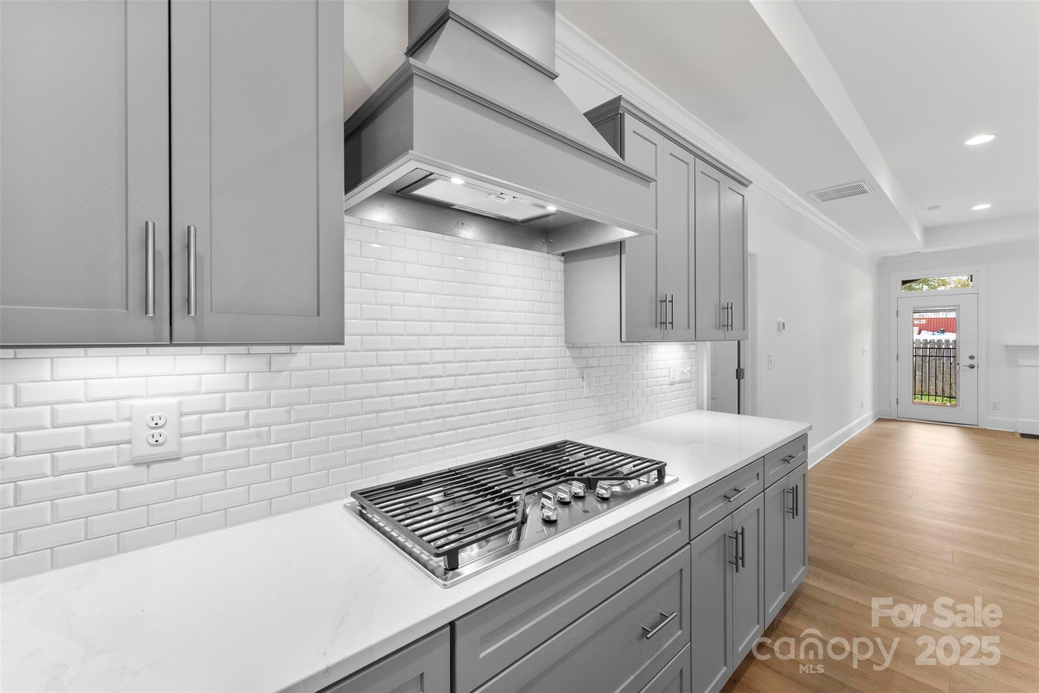 415 Newstyle Way Gastonia, NC 28056 - Photo 5 of 26 a kitchen with granite countertop a stove and a sink