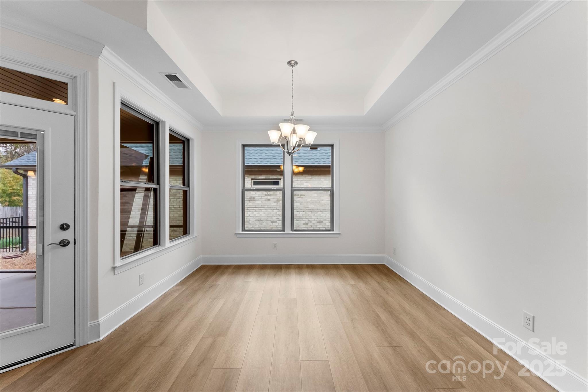 415 Newstyle Way Gastonia, NC 28056 - Photo 10 of 26 a view of an empty room with wooden floor and a window