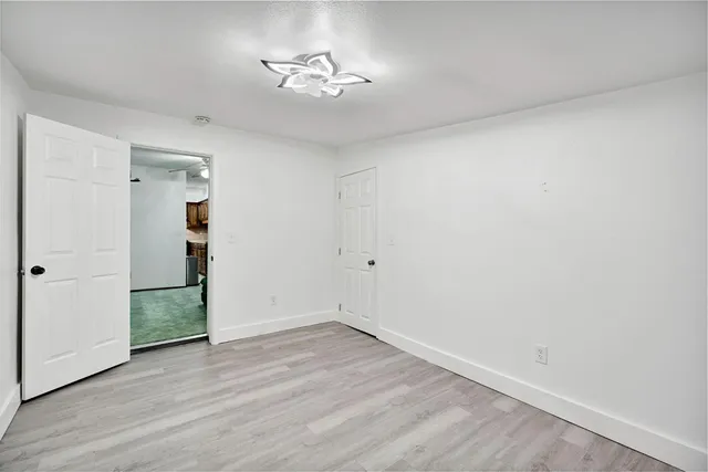a bedroom with furniture and flat screen tv