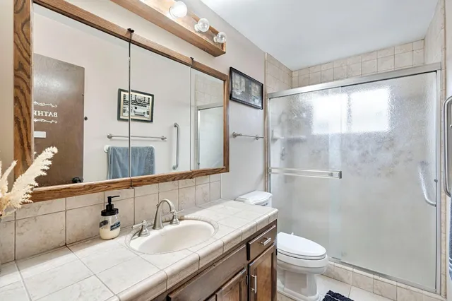 a bedroom with a bed and flat screen tv