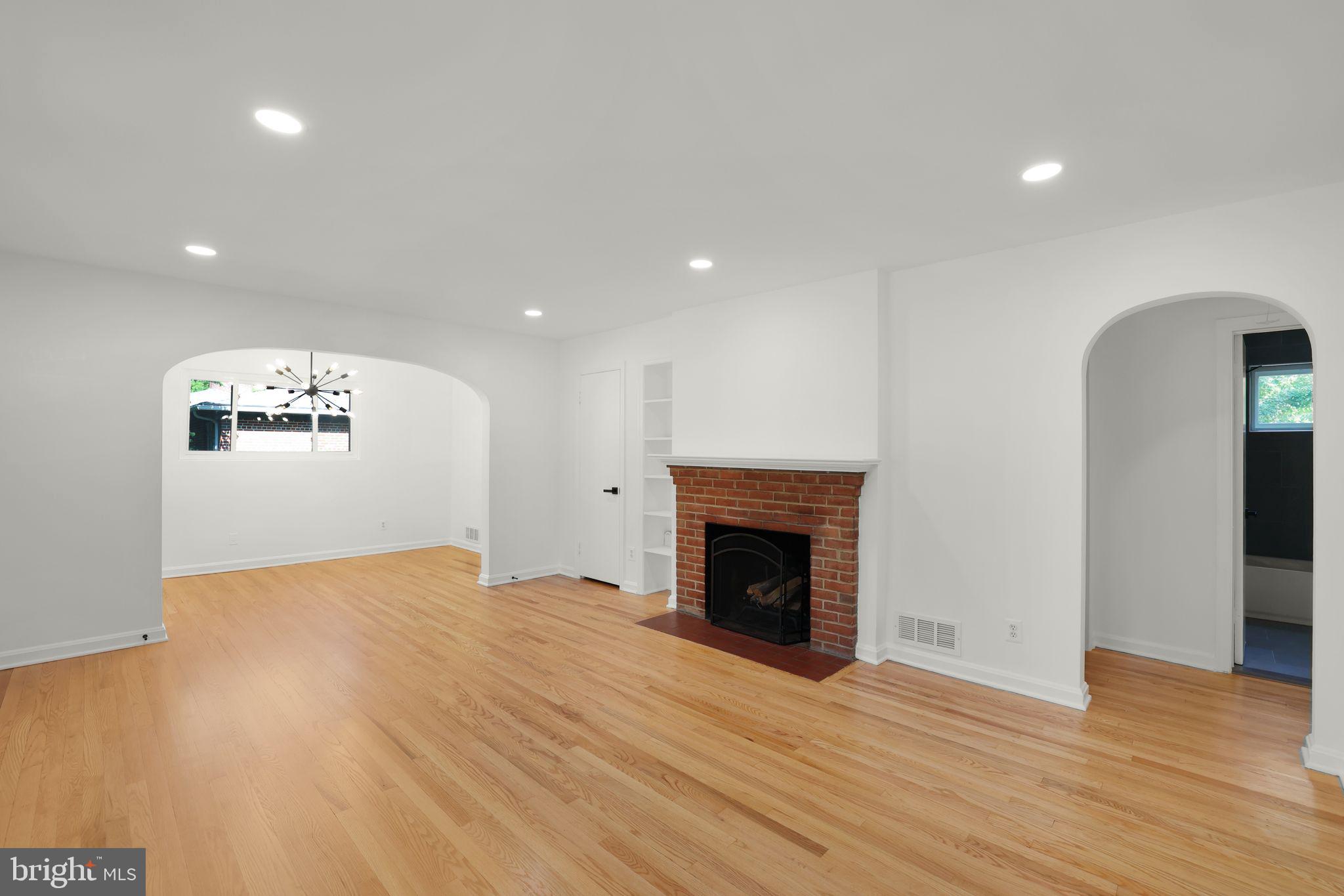 2423 Homestead Drive Silver Spring, MD 20902 - Photo 12 of 45 a view of empty room with wooden floor and fireplace