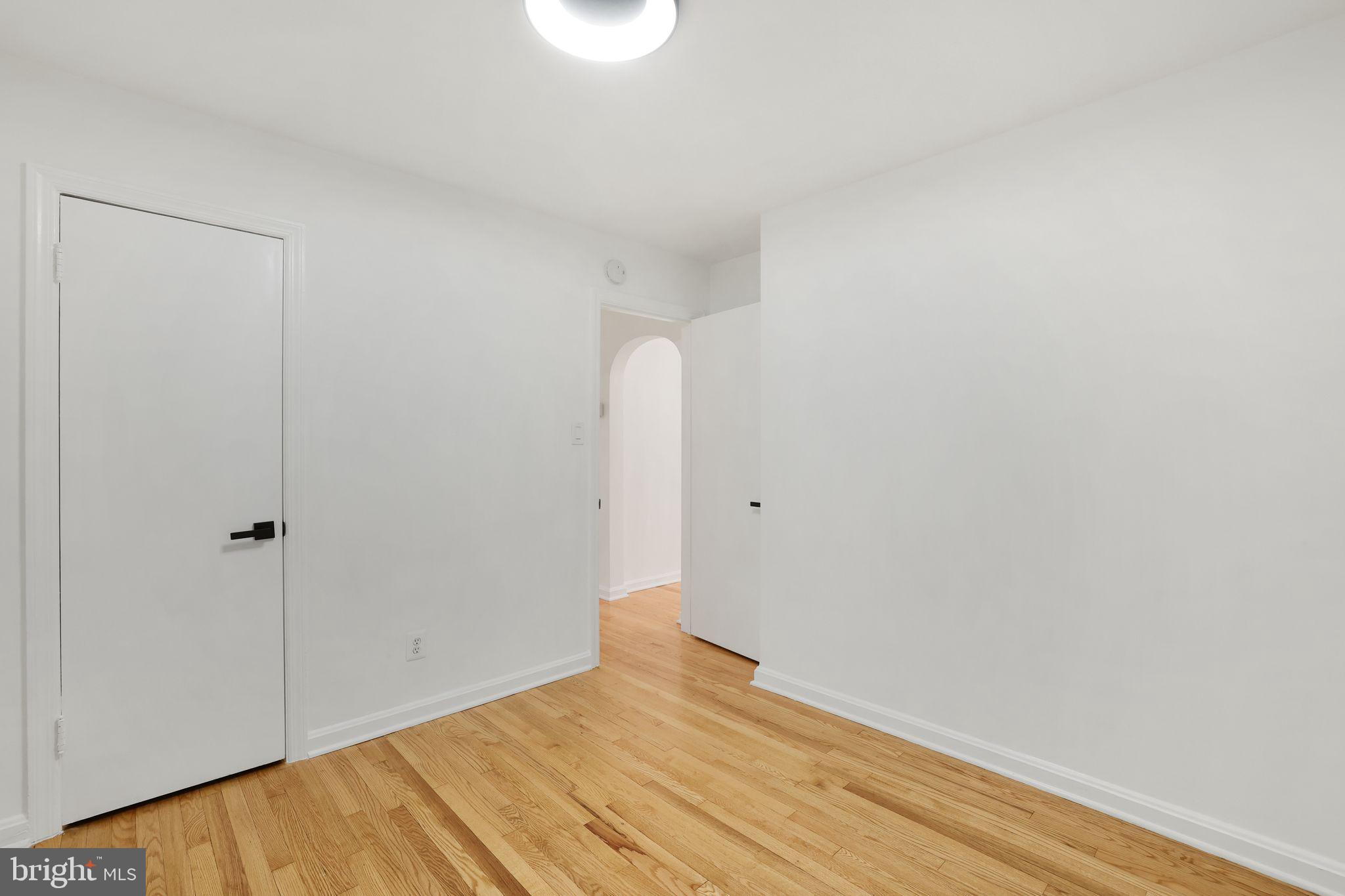 2423 Homestead Drive Silver Spring, MD 20902 - Photo 16 of 45 a view of empty room with wooden floor