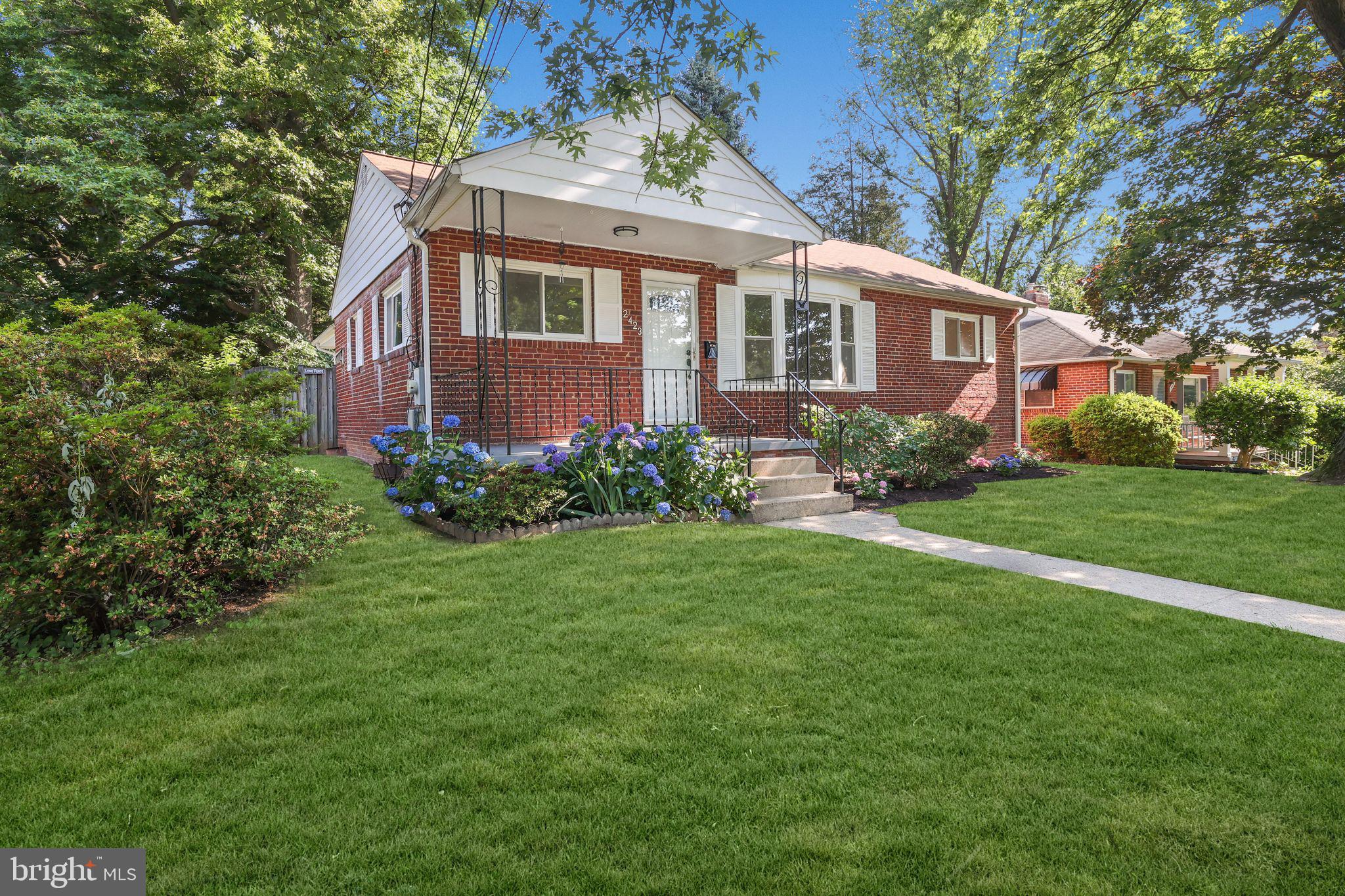 2423 Homestead Drive Silver Spring, MD 20902 - Photo 2 of 45 a front view of a house with garden