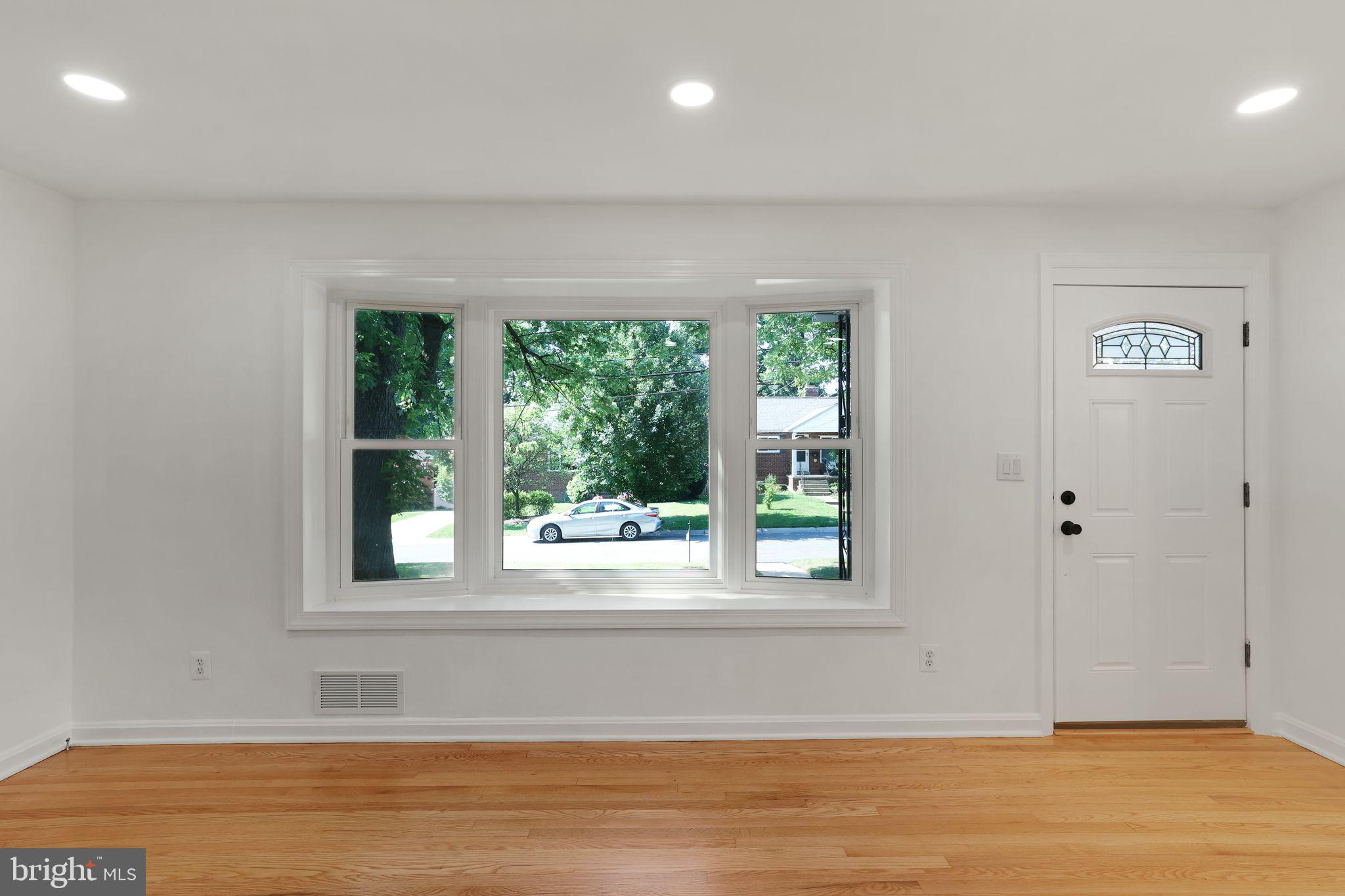 2423 Homestead Drive Silver Spring, MD 20902 - Photo 23 of 45 a view of a room that has a window and wooden floor