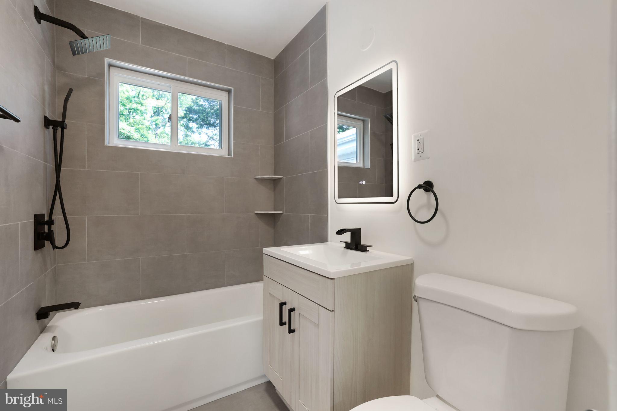2423 Homestead Drive Silver Spring, MD 20902 - Photo 24 of 45 a bathroom with a sink a toilet and a bathtub