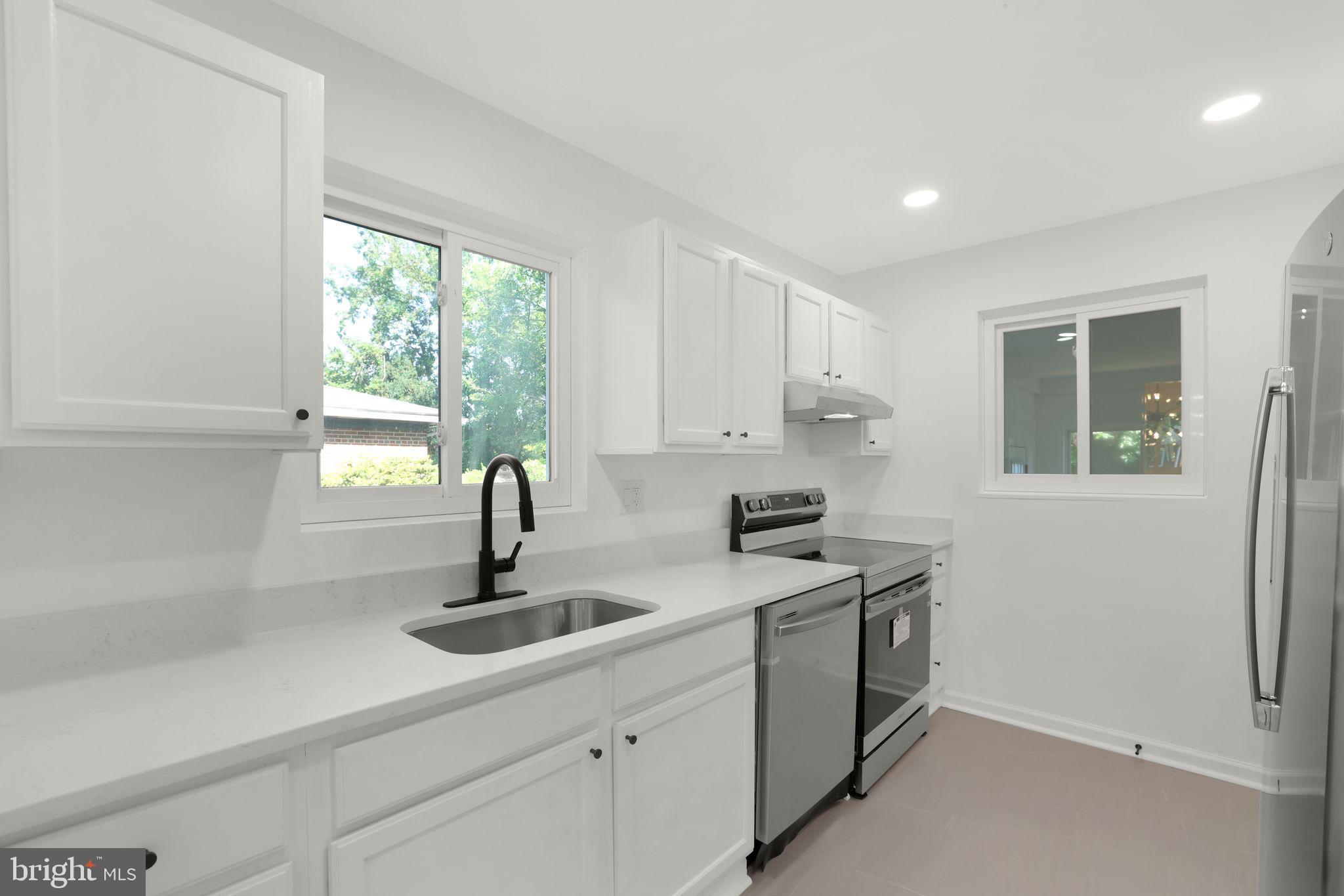 2423 Homestead Drive Silver Spring, MD 20902 - Photo 28 of 45 a kitchen with a sink and cabinets