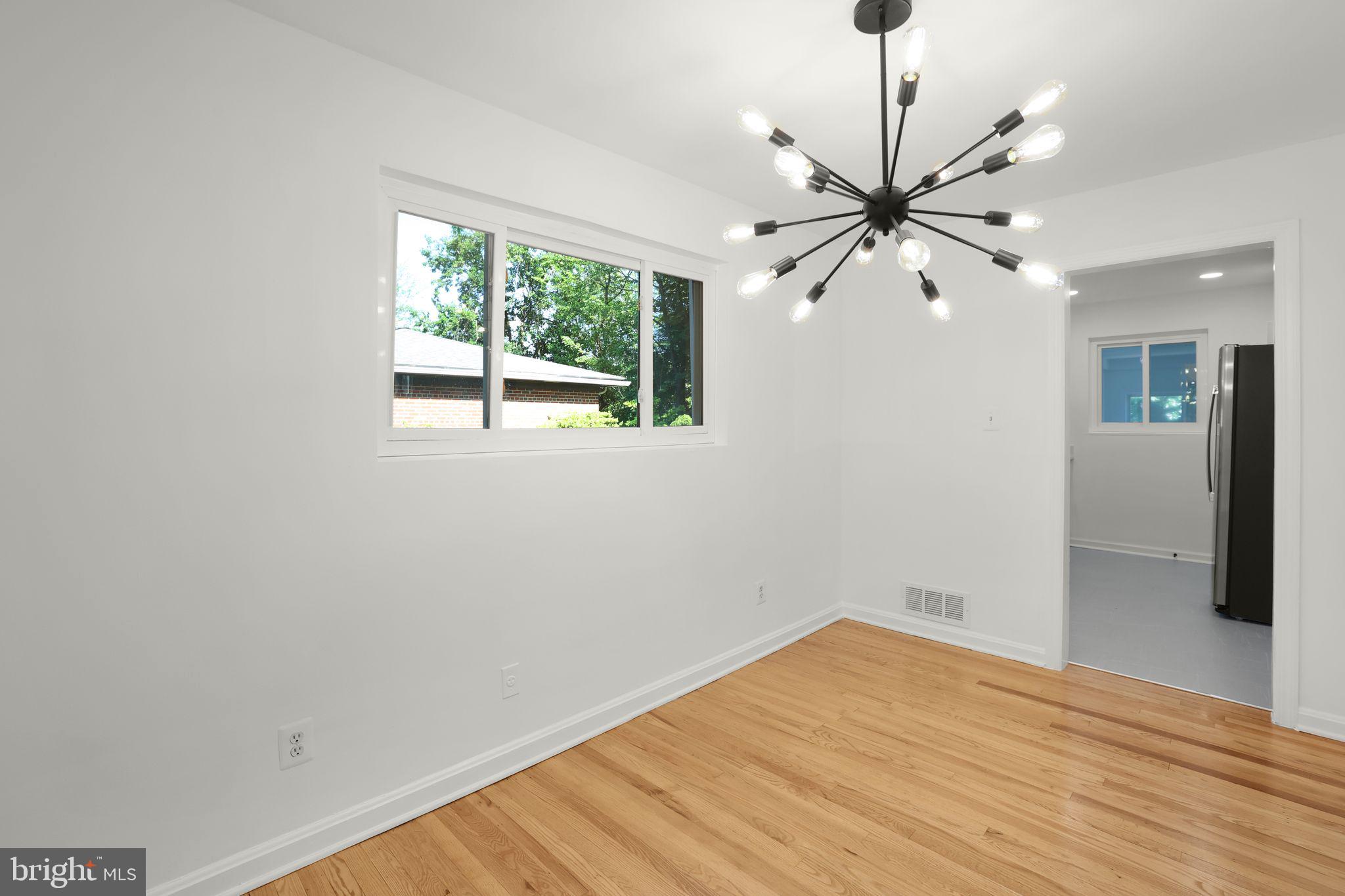 2423 Homestead Drive Silver Spring, MD 20902 - Photo 8 of 45 a view of empty room with wooden floor and fan