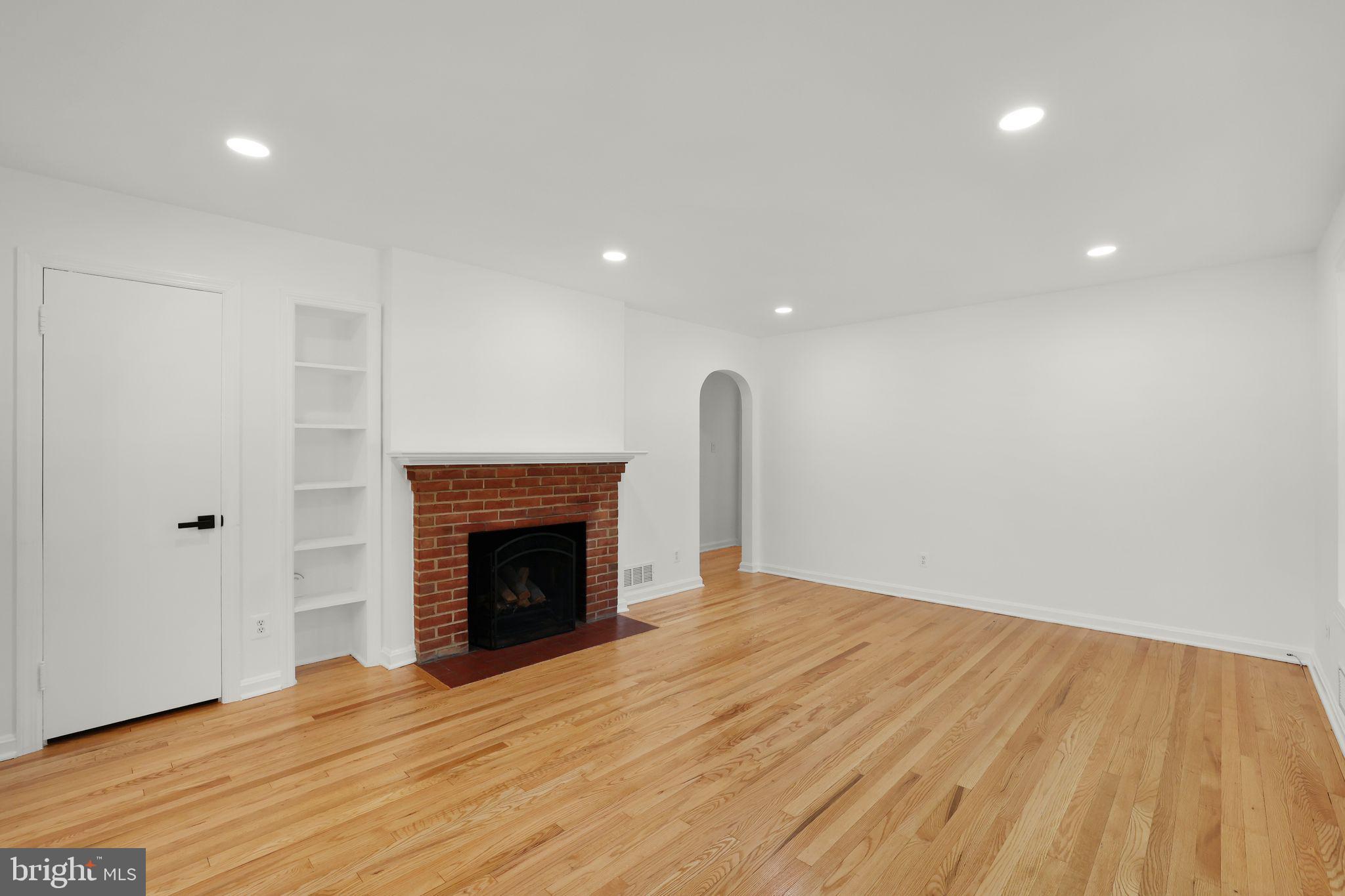 2423 Homestead Drive Silver Spring, MD 20902 - Photo 10 of 45 a view of empty room with wooden floor and fireplace