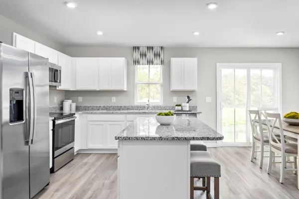 a dining room with furniture and wooden floor