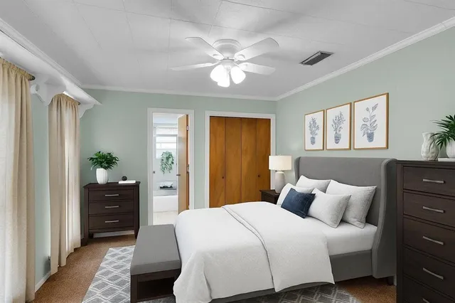 a bedroom with a bed and a dresser