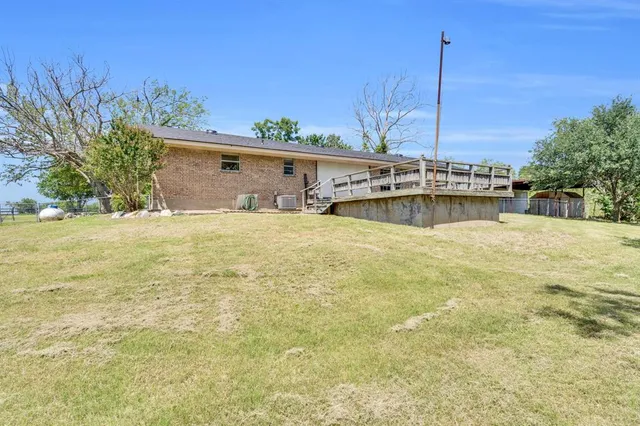 a swimming pool with lawn chairs