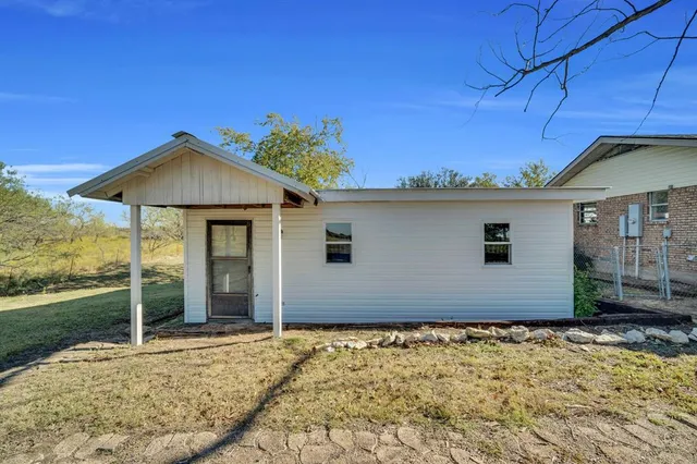 a house with yard in front of it