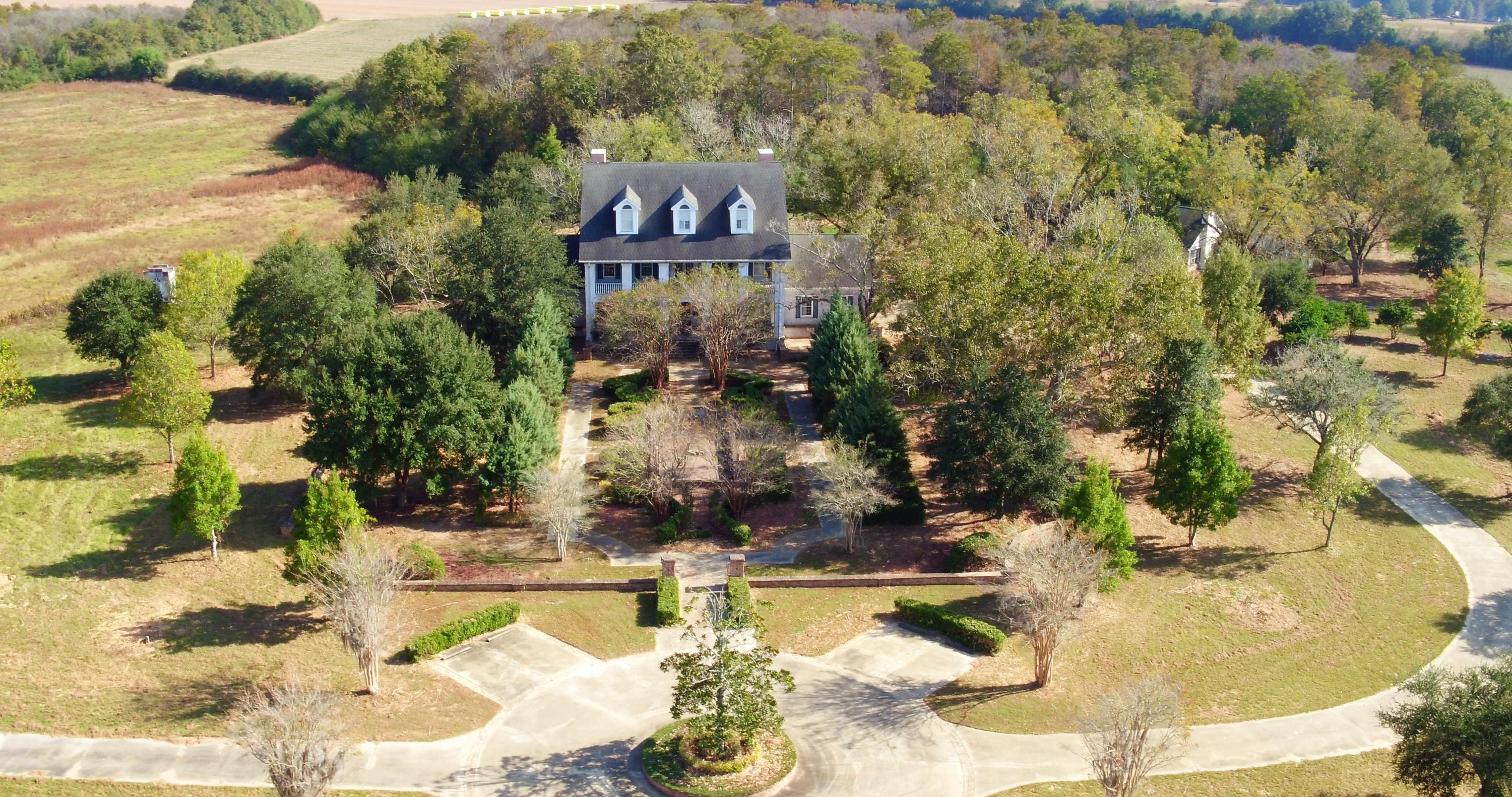 5437 Griffith Mill Road Baker, FL 32531 - Photo 1 of 100 a swimming pool with trees in the background
