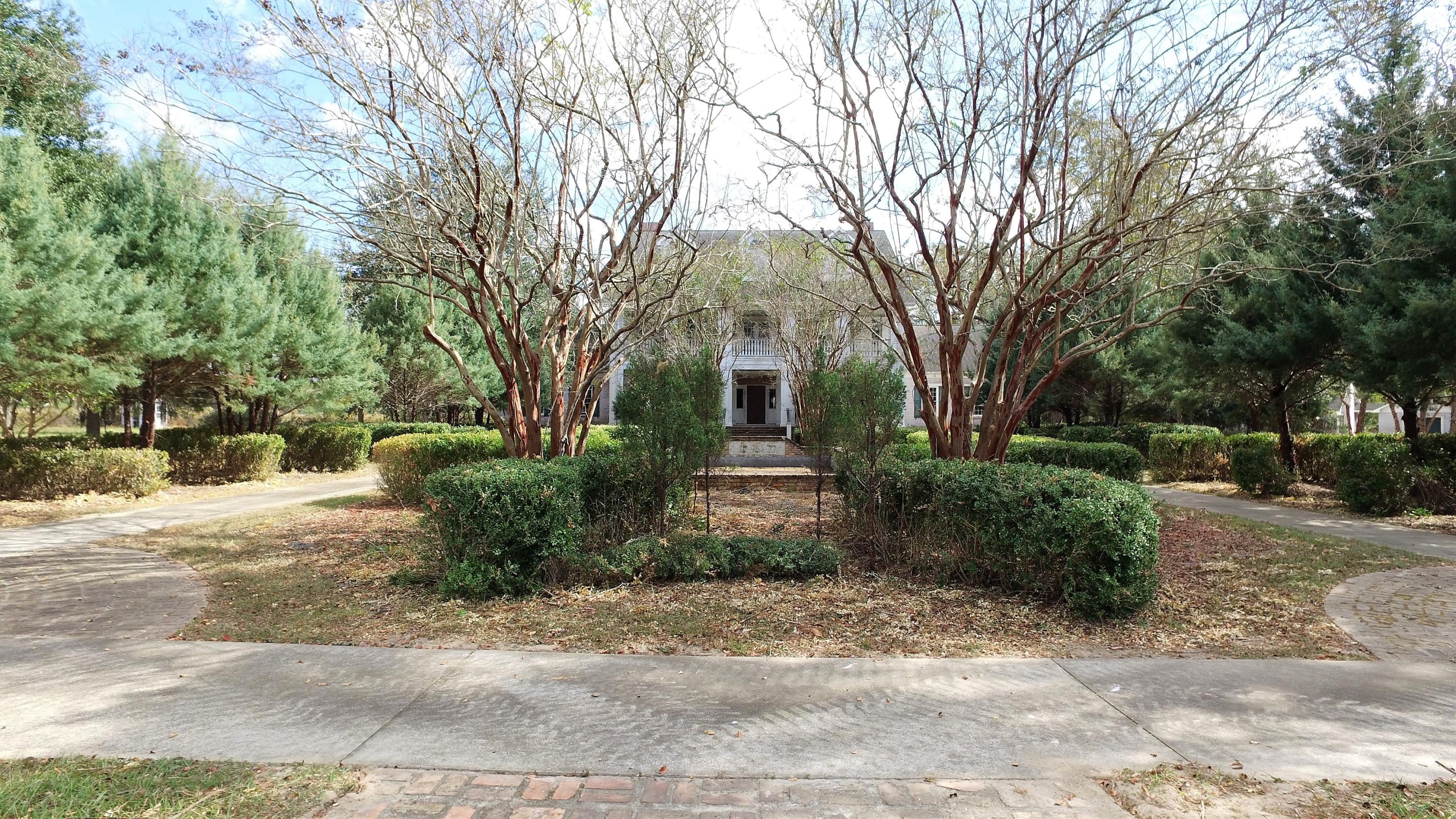 5437 Griffith Mill Road Baker, FL 32531 - Photo 18 of 100 a front view of a house with a yard and shrubs