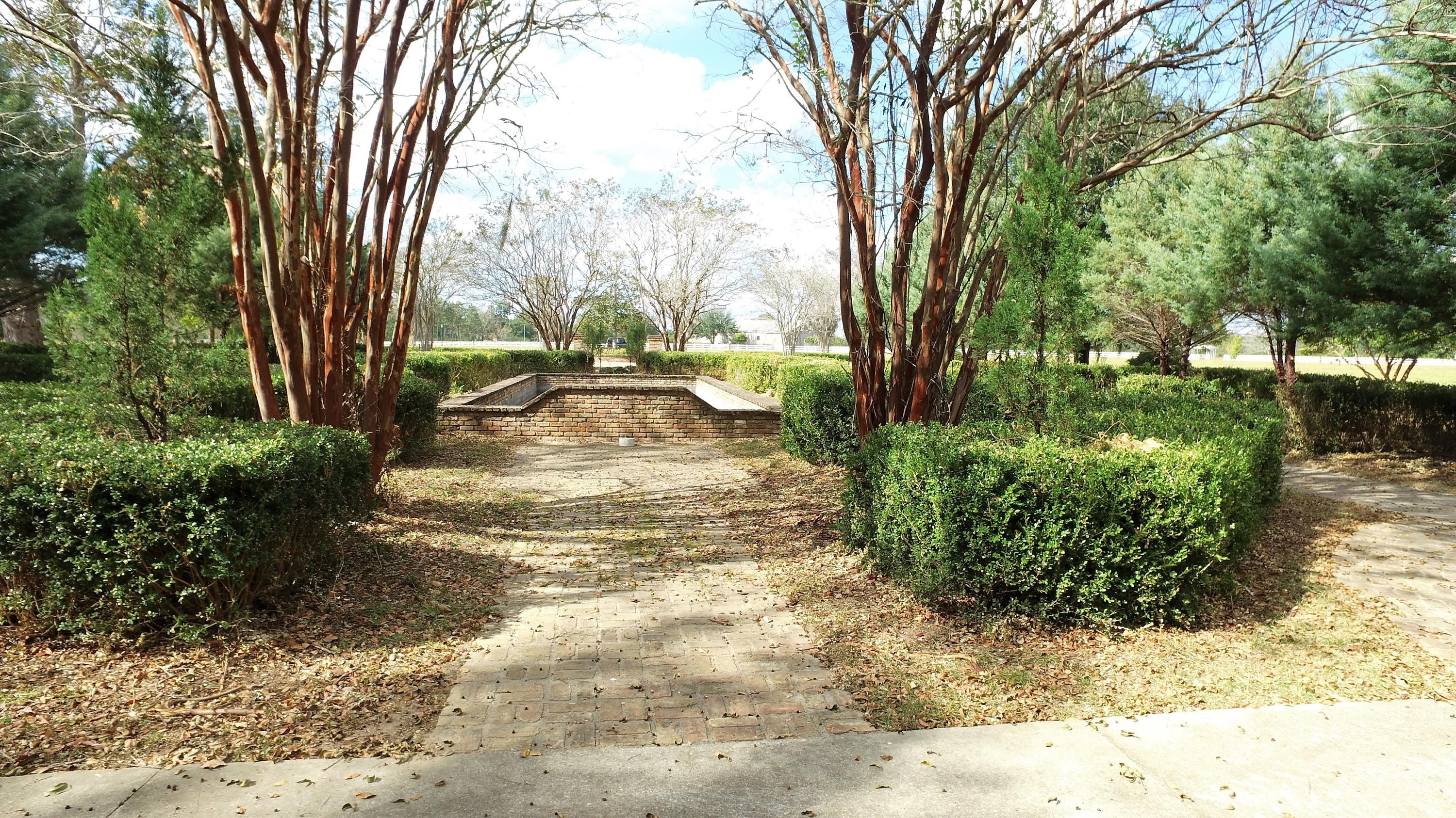 5437 Griffith Mill Road Baker, FL 32531 - Photo 24 of 100 a view of a backyard with large trees