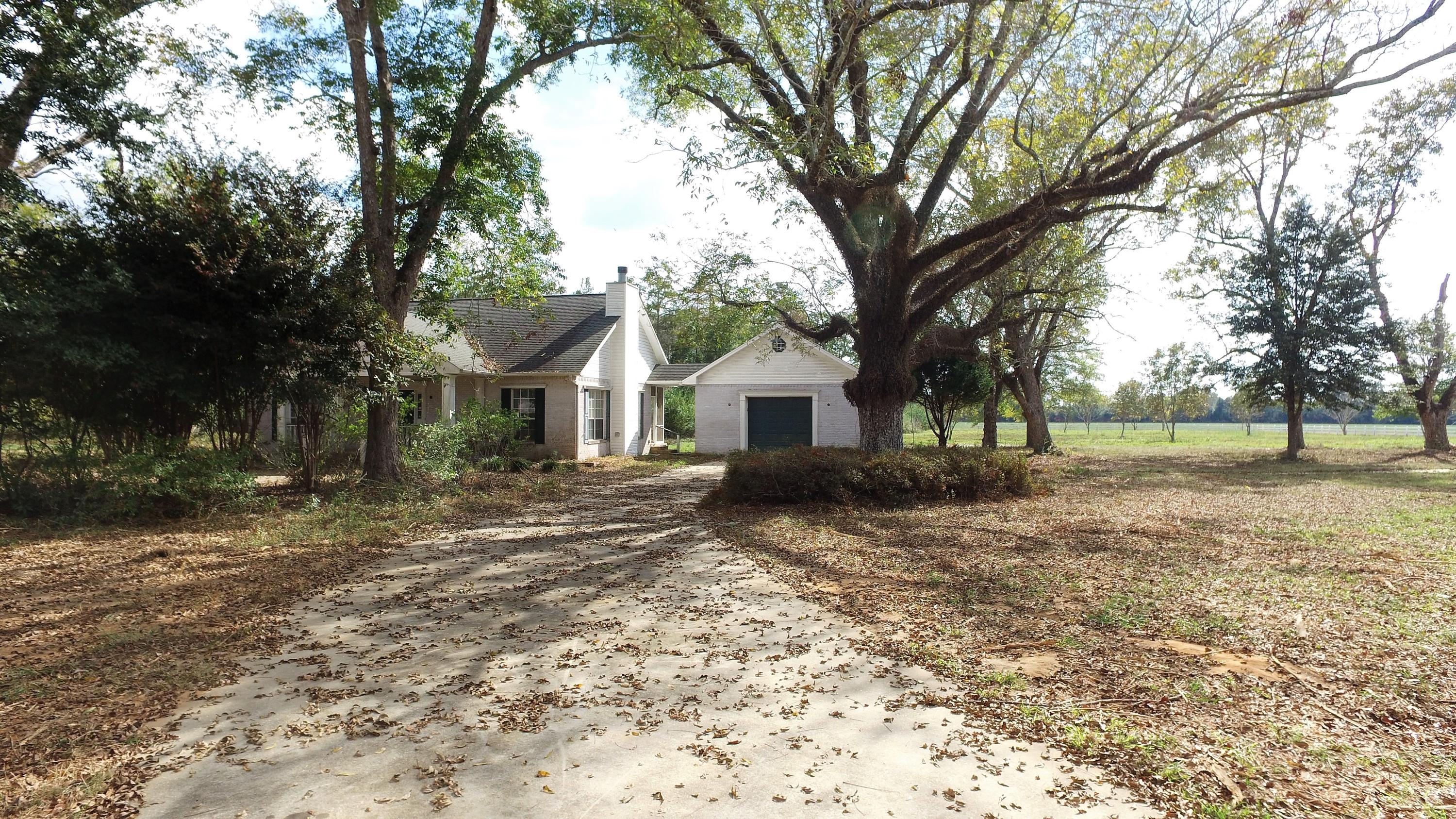 5437 Griffith Mill Road Baker, FL 32531 - Photo 31 of 100 a view of house with yard and tree
