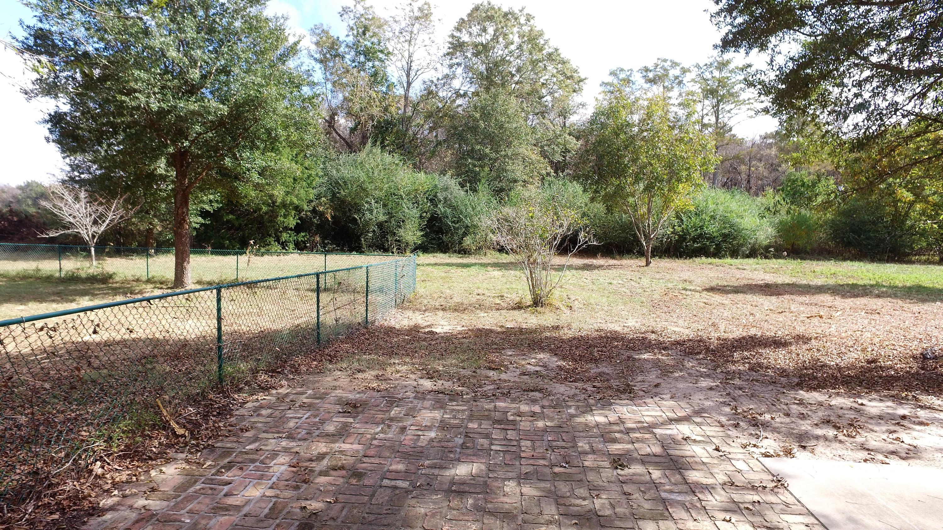 5437 Griffith Mill Road Baker, FL 32531 - Photo 34 of 100 a view of a yard with trees
