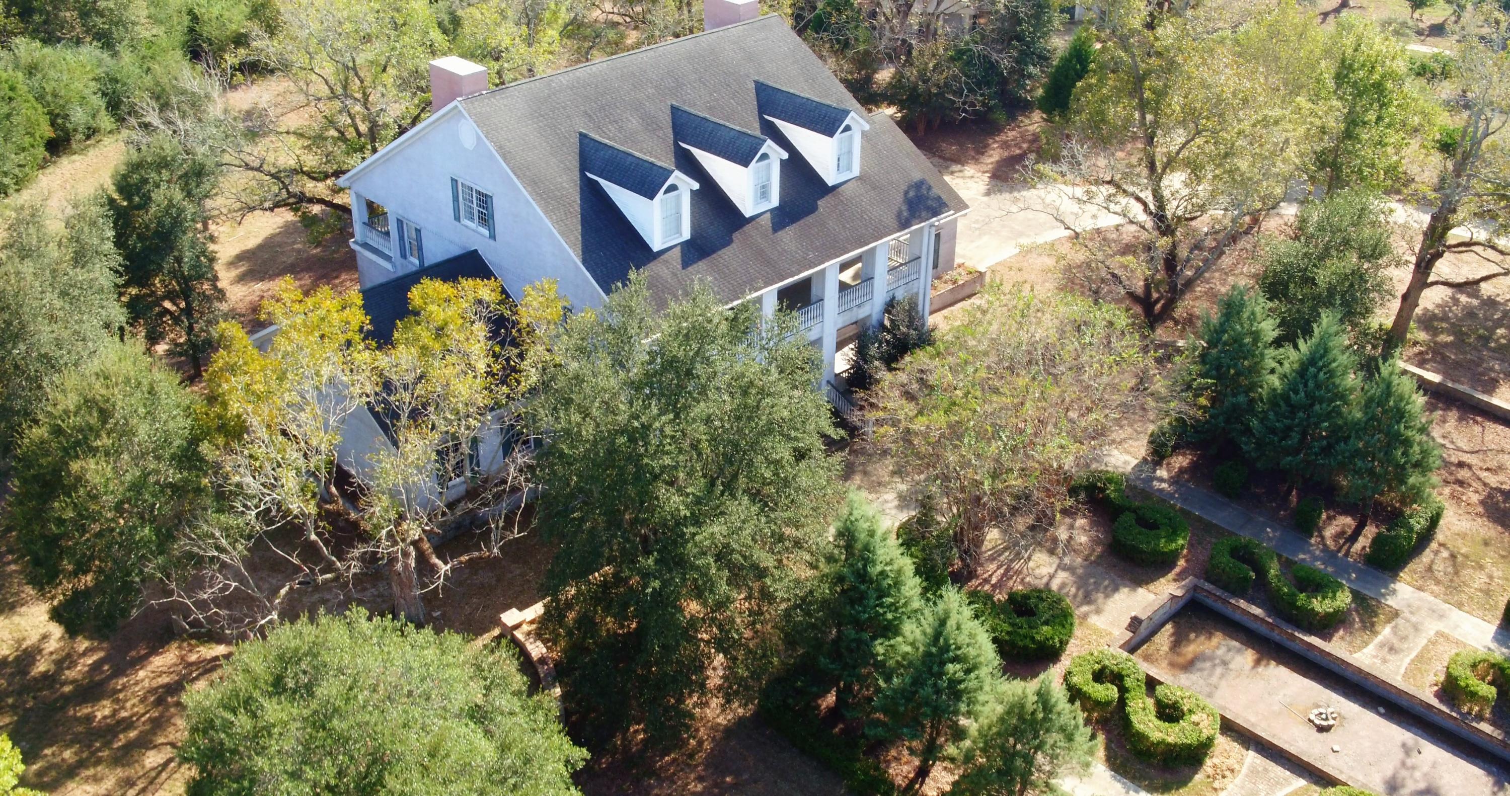 5437 Griffith Mill Road Baker, FL 32531 - Photo 53 of 100 front view of a house with a yard and potted plants